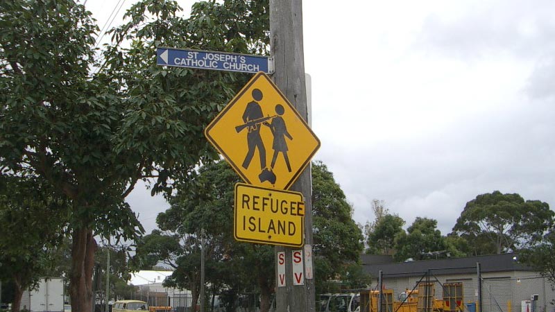 Altered road sign suggesting Australia is a refugee island?
